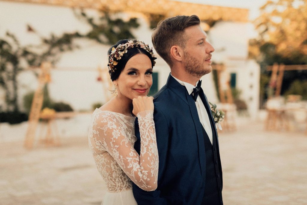 A love filled outdoor ceremony amongst olive trees with a rustic courtyard wedding in beautiful Puglia