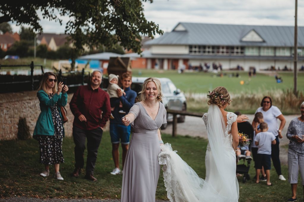 Bride overwhelmed as guests who couldn't attend her wedding due to COVID restrictions comes to meet her before the service