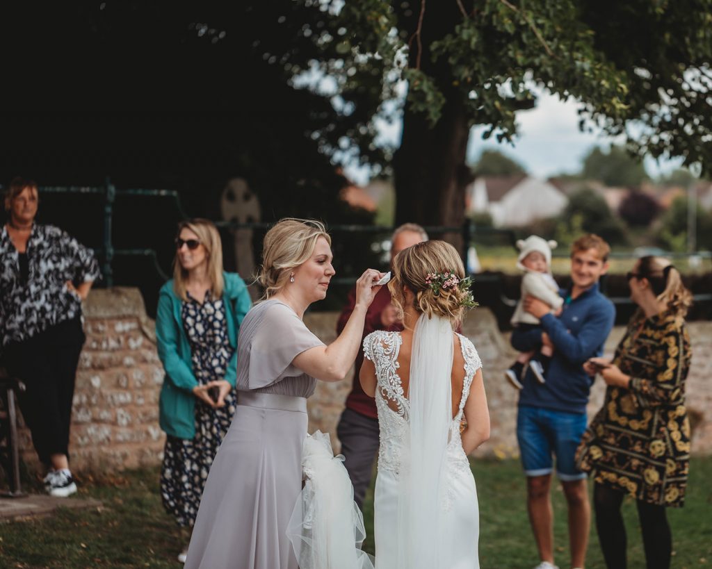 Bride overwhelmed as guests who couldn't attend her wedding due to COVID restrictions comes to meet her before the service