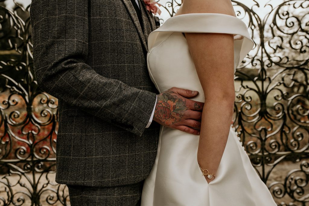 Close up of newlyweds with the bride wearing a dress with pockets