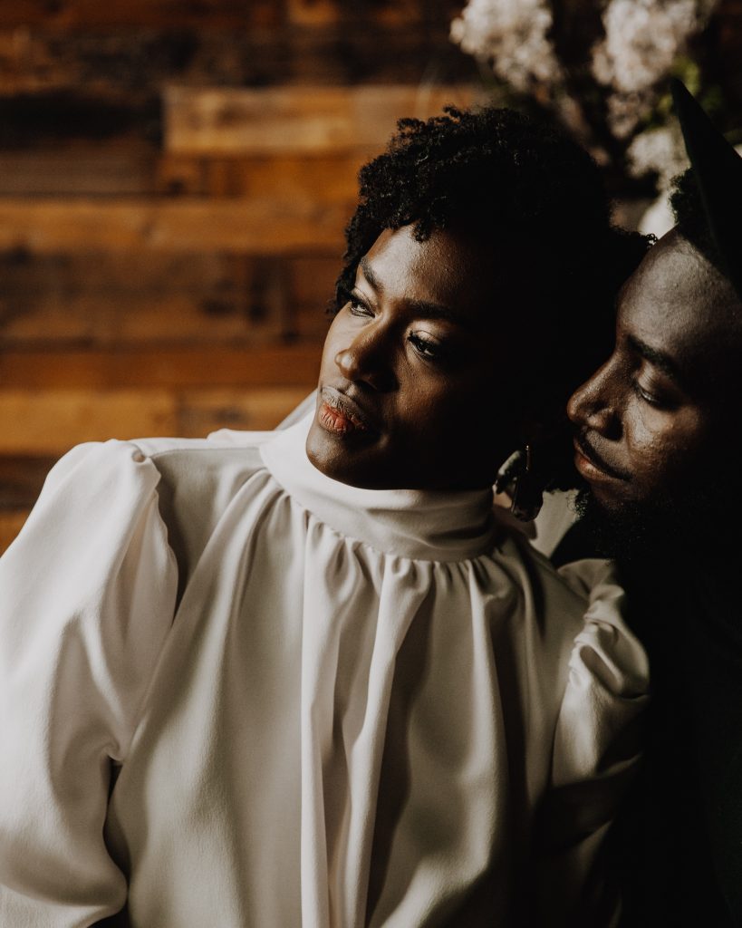 Newlywed bride and groom cuddling up together