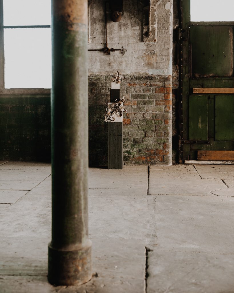 A wedding cake display of earthy tones and muted hues for an industrial micro wedding