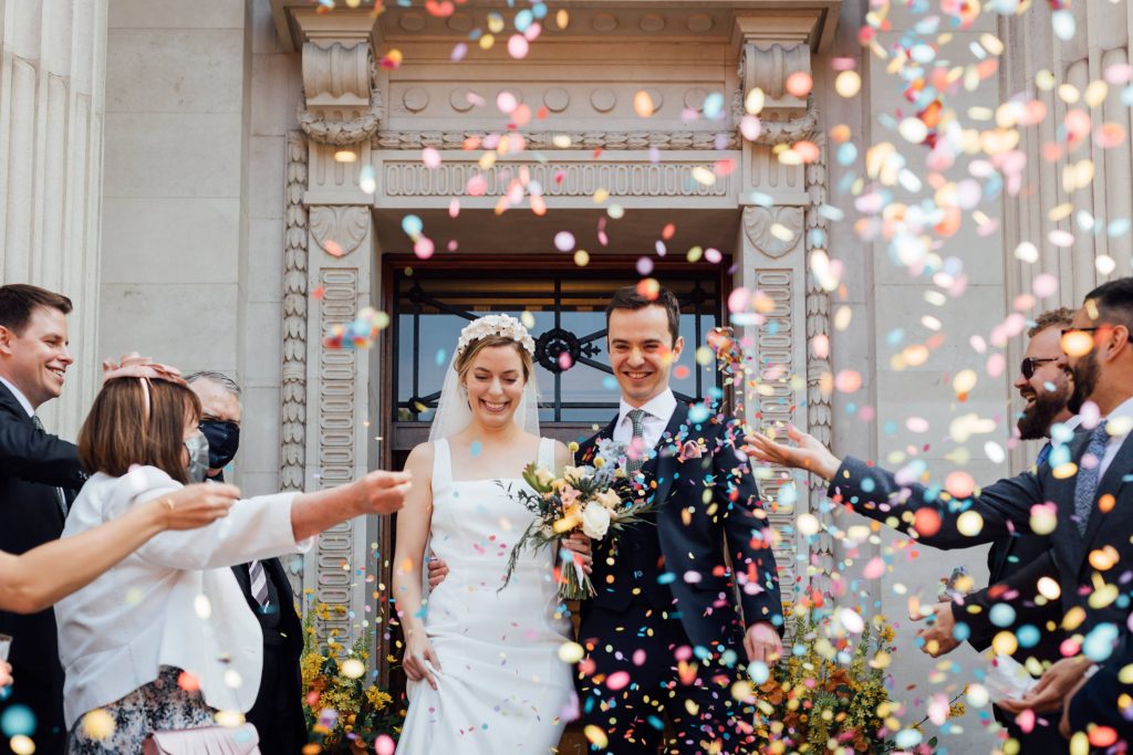 Colourful confetti shot for newly wed city micro wedding couple