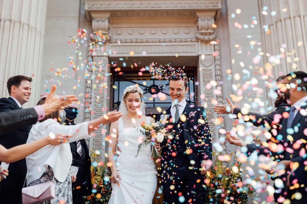 Colourful confetti shot for newly wed city micro wedding couple