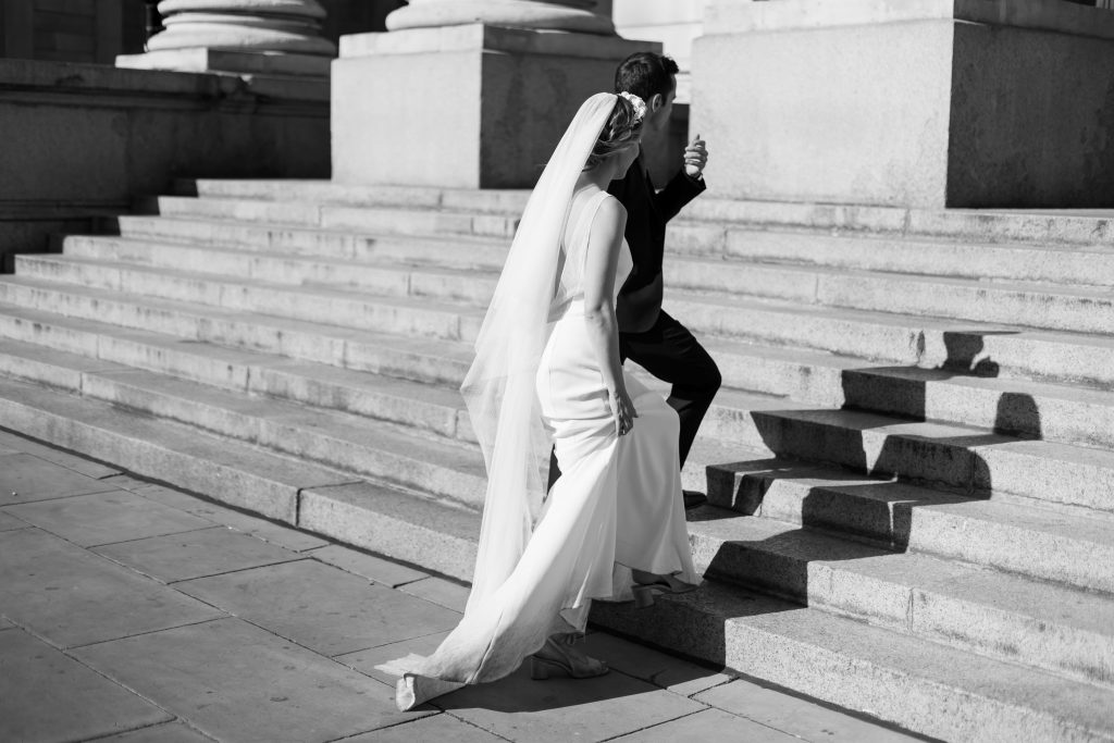 Black and white couple portrait shot of couple walking up stairs
