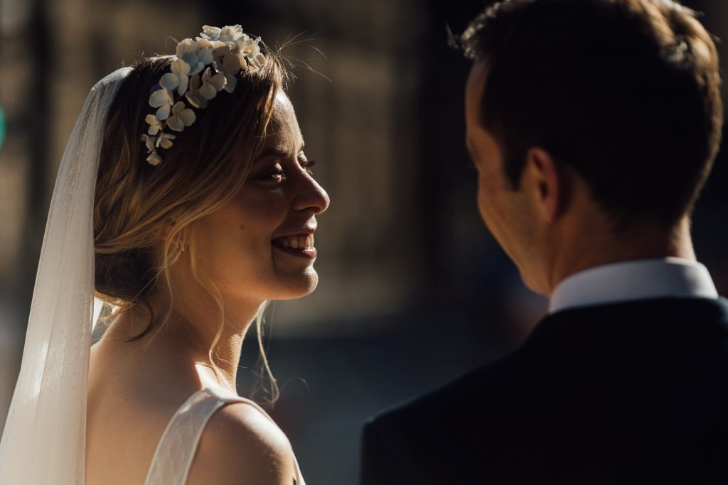 Newly married bride gazes lovingly at her new husband