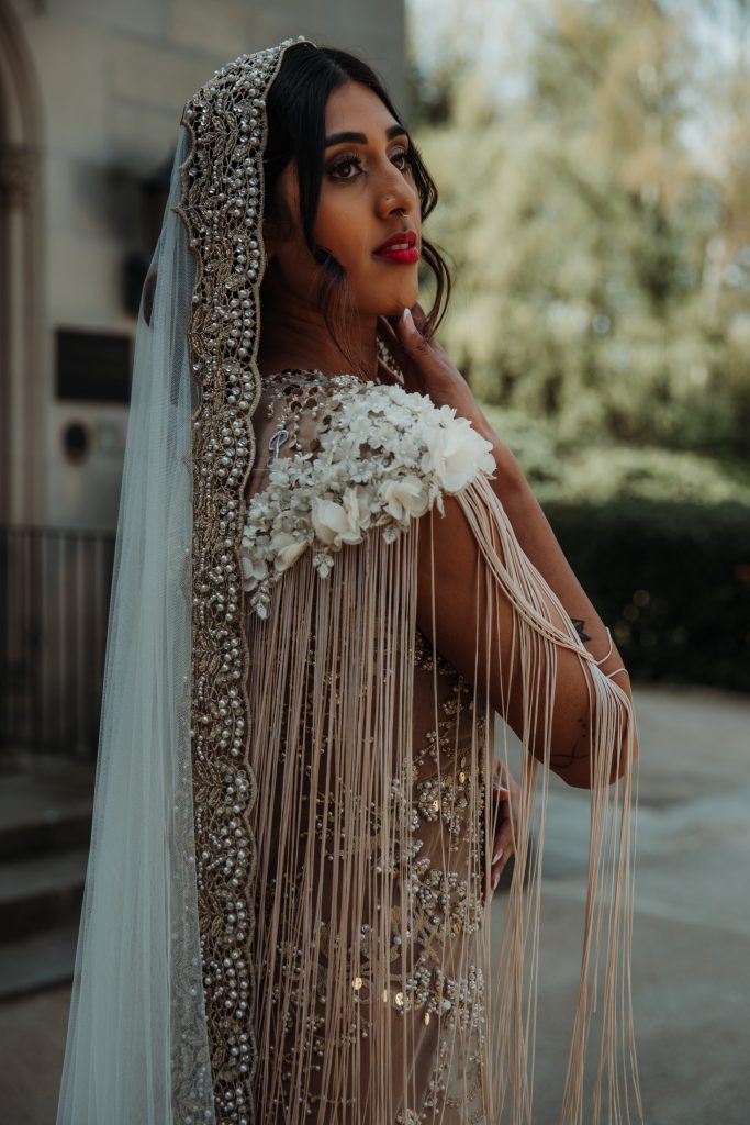 Close up back detailing of Julita LDN Bride's fringed shoulder wedding dress with hand beaded embellishment
