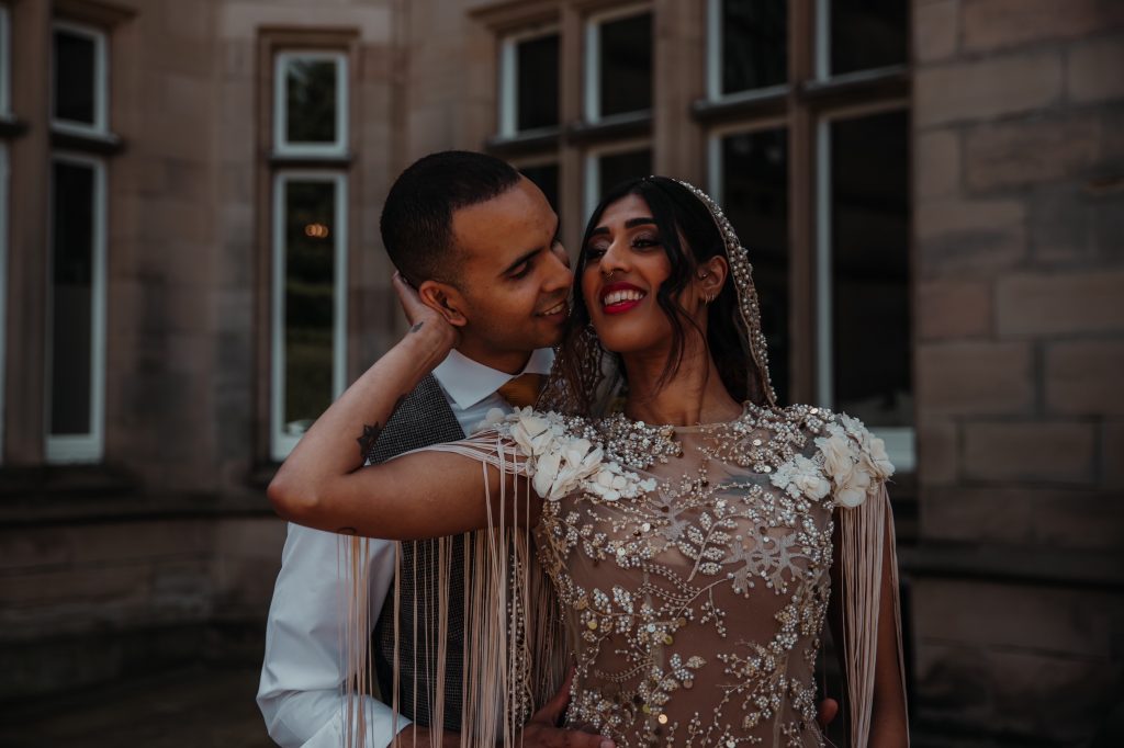 Happy bride and groom celebrate a joyful embrace on their wedding day