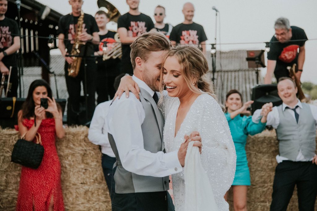 First dance delight for newly married bride and groom during outdoor evening celebration