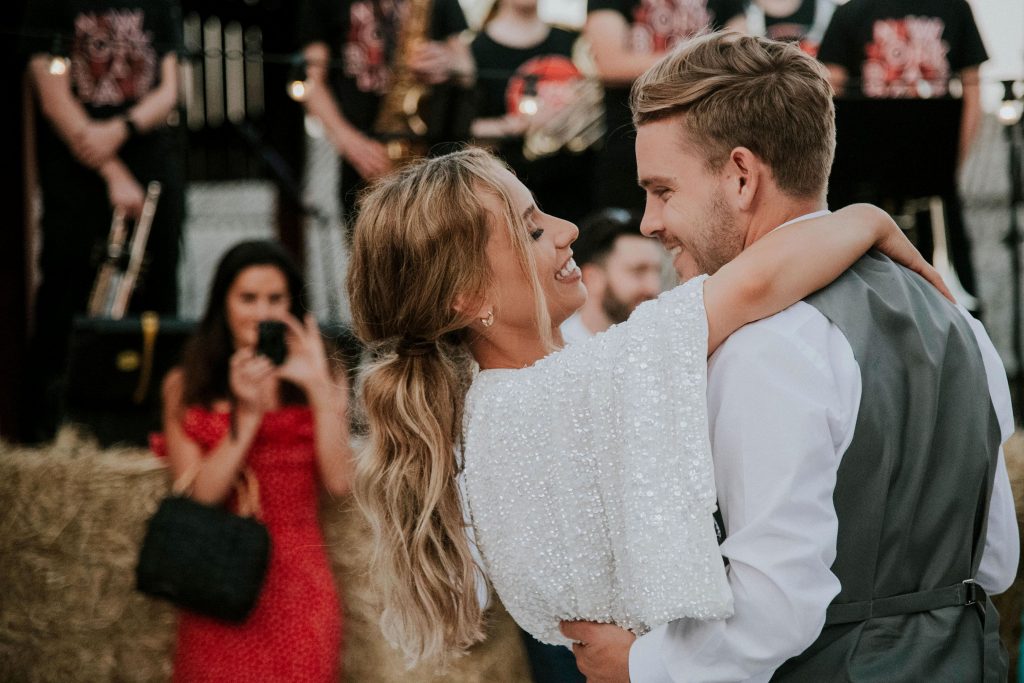 A first dance for newlyweds during their outdoor evening celebrations