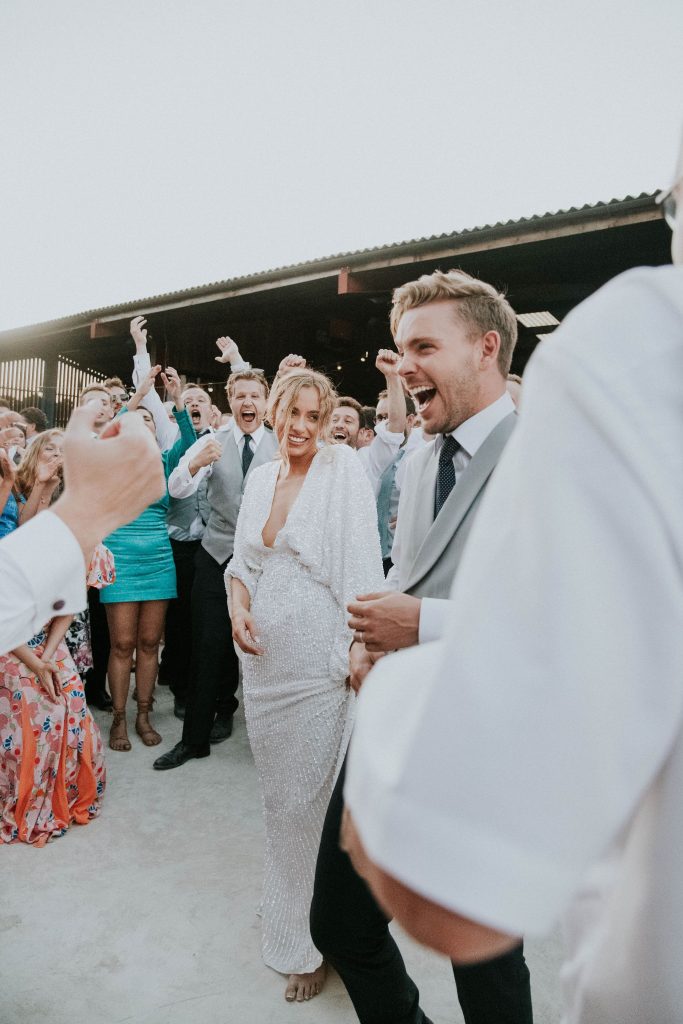 Evening wedding party in full flow during festival vibe summer wedding