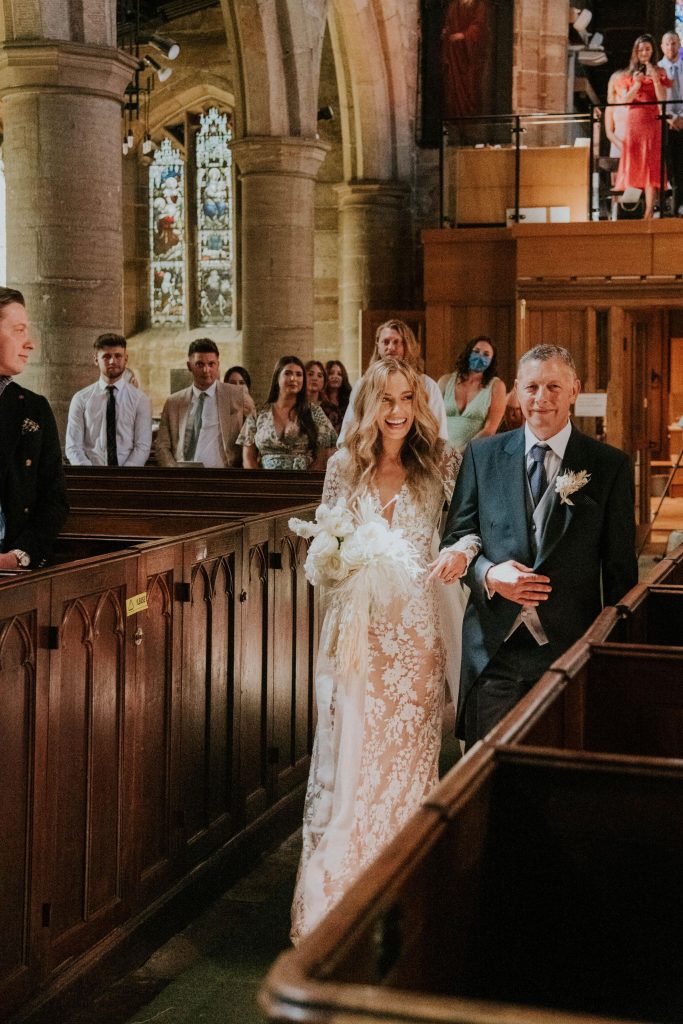 Dad walks beautiful bride down the aisle for church wedding service