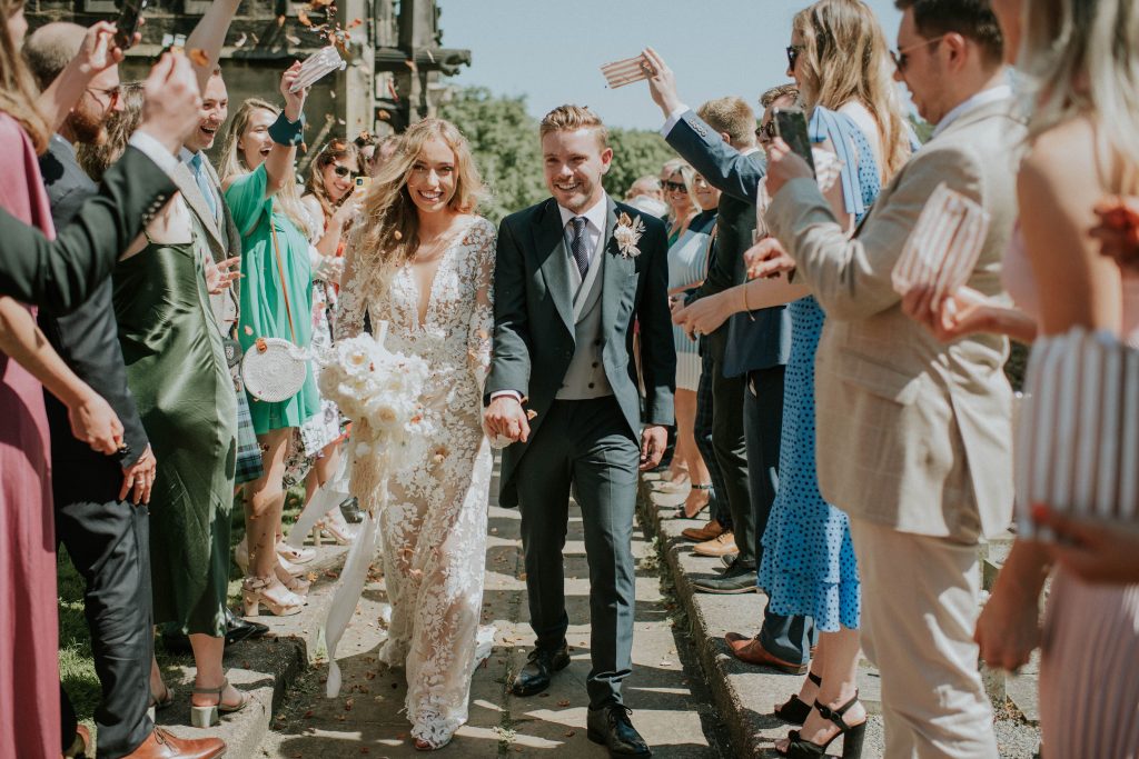 Confetti shot for newly married summer wedding couple