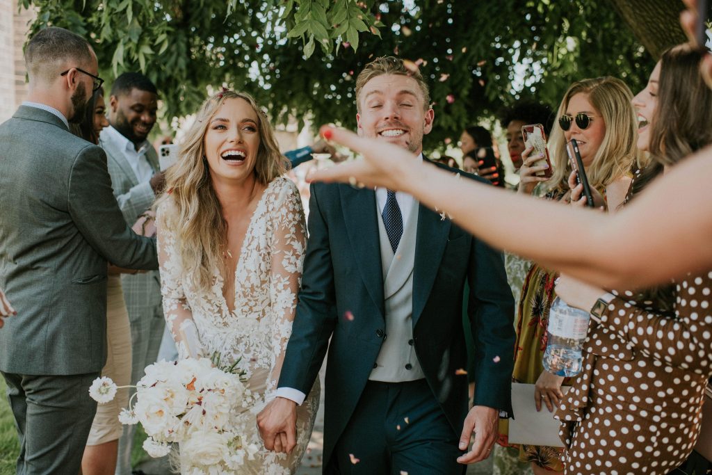 Confetti shot for newly married summer wedding couple