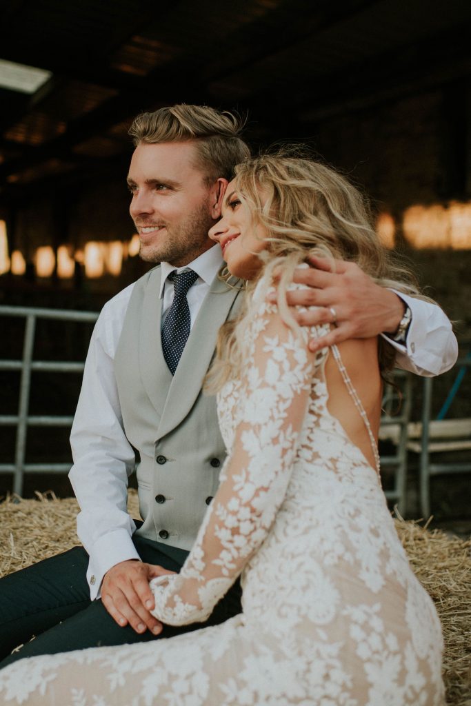 Wedding cuddles for newlyweds soaking in their wedding day together