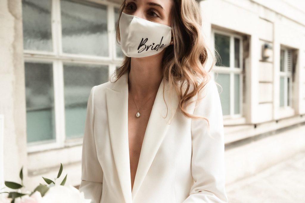 An intimate city micro wedding with white bridal suit