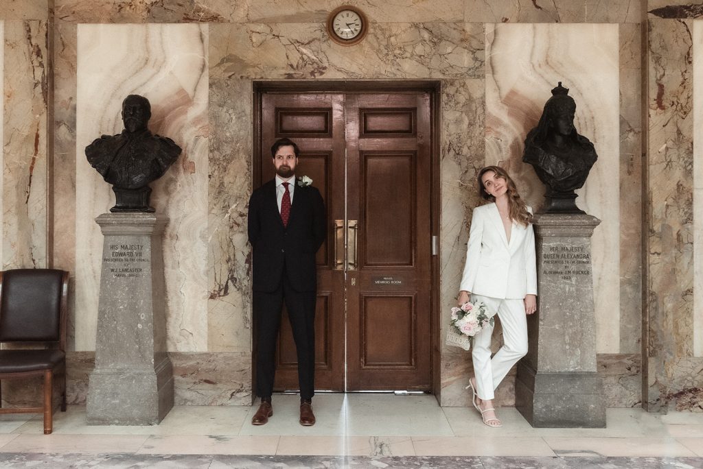 Bride and groom in marble hall of Wandsworth Town Hall