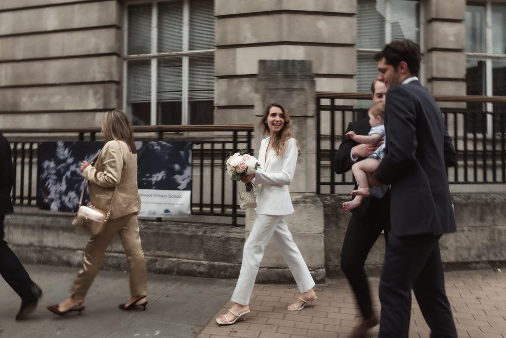 City bride in white bridal suit