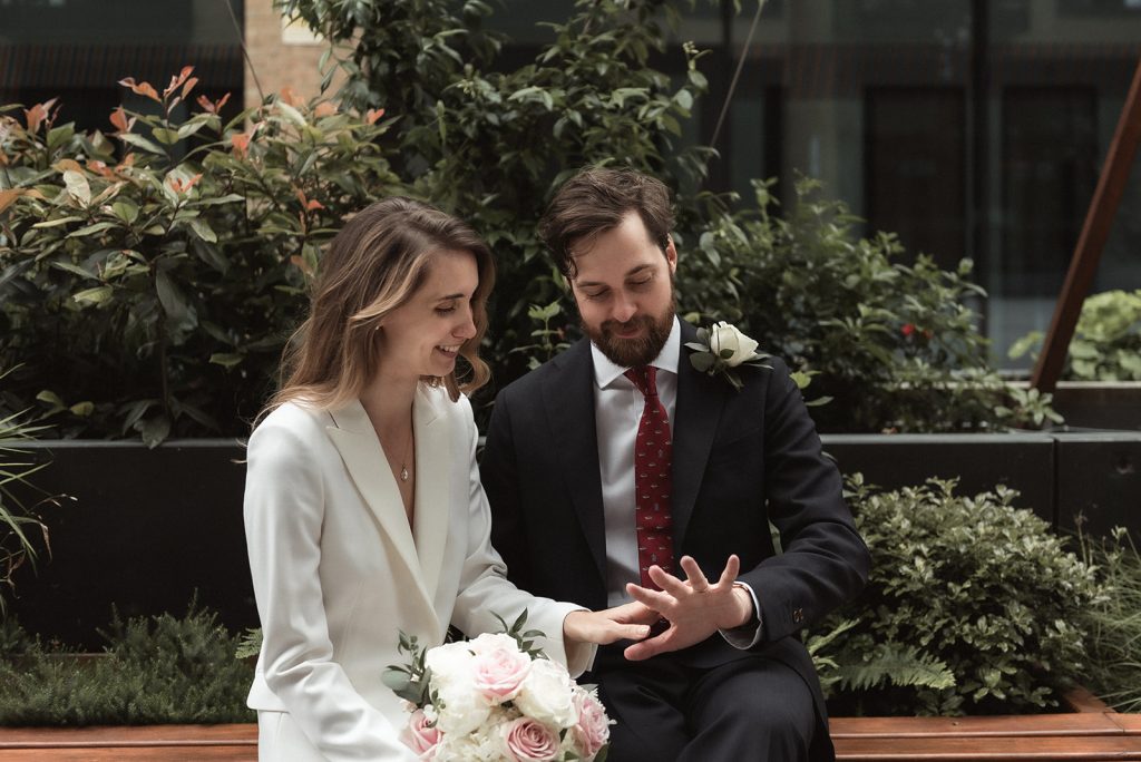 Newlywed bride and groom in chic relaxed city wedding