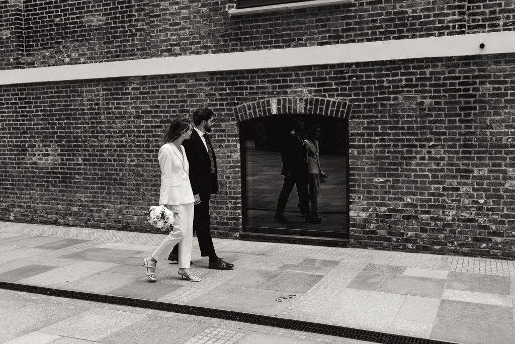 Newlywed bride and groom in chic relaxed city wedding