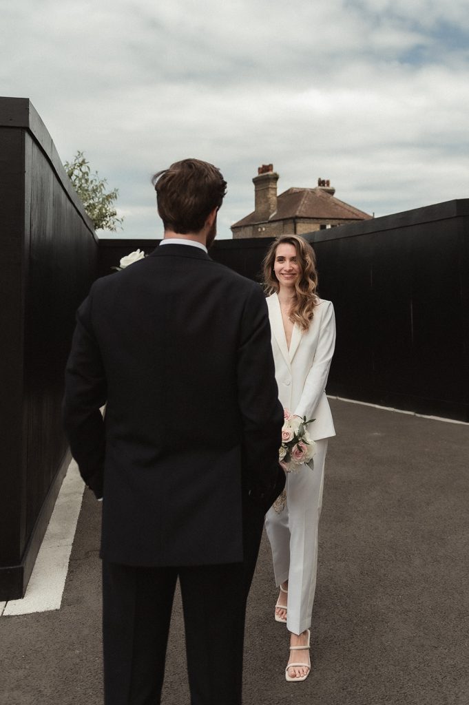 Newlywed bride and groom in chic relaxed city wedding