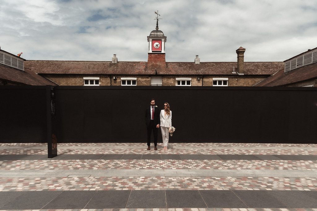 Newlywed bride and groom in chic relaxed city wedding