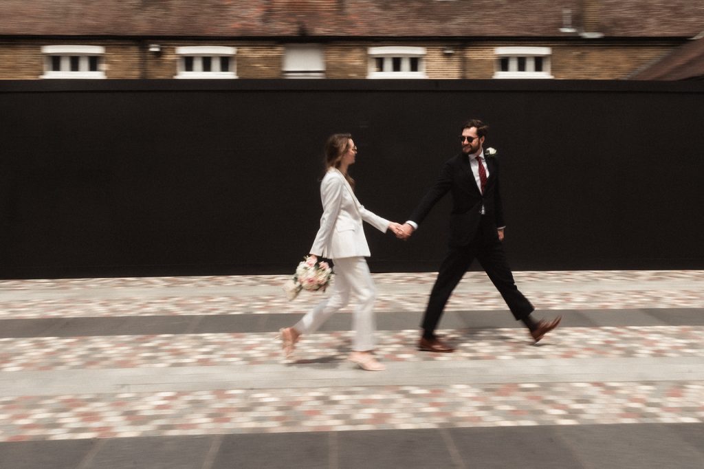 Newlywed bride and groom in chic relaxed city wedding