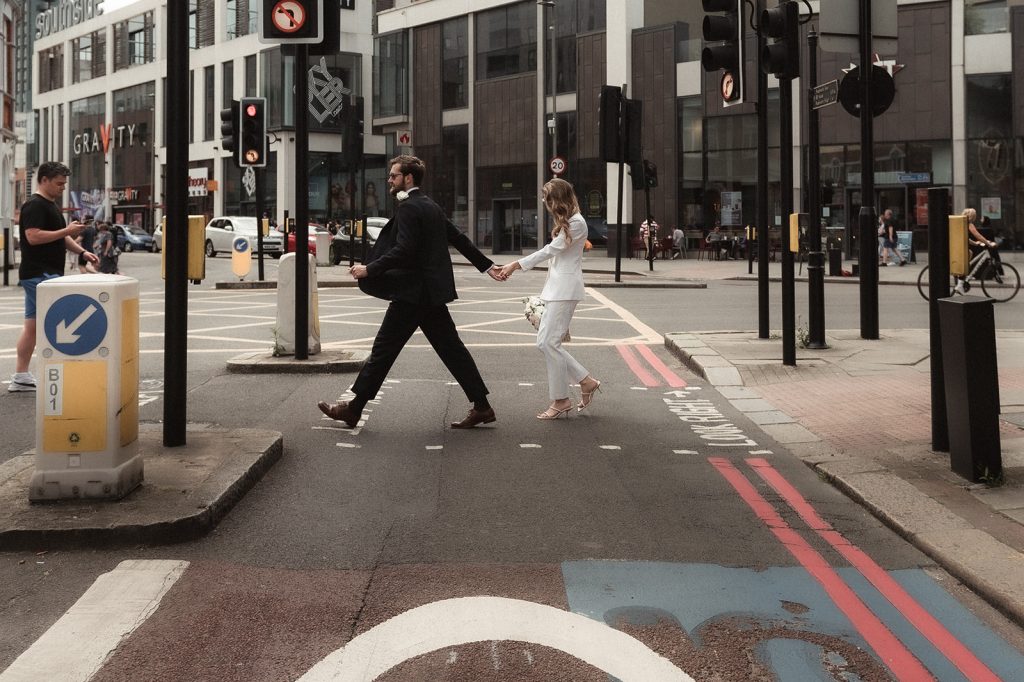 Newlywed bride and groom in chic relaxed city wedding