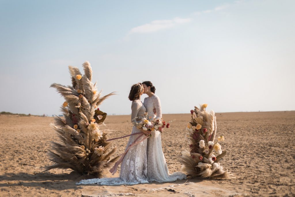 beach wedding elopement with pampas pillars