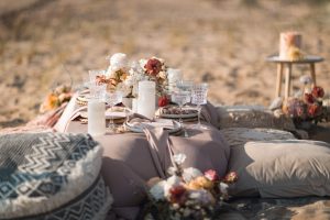 Wedding beach themed tablescape in a sunset colour palette