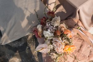 Wedding beach themed tablescape in a sunset colour palette