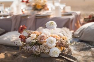 Wedding beach themed tablescape in a sunset colour palette