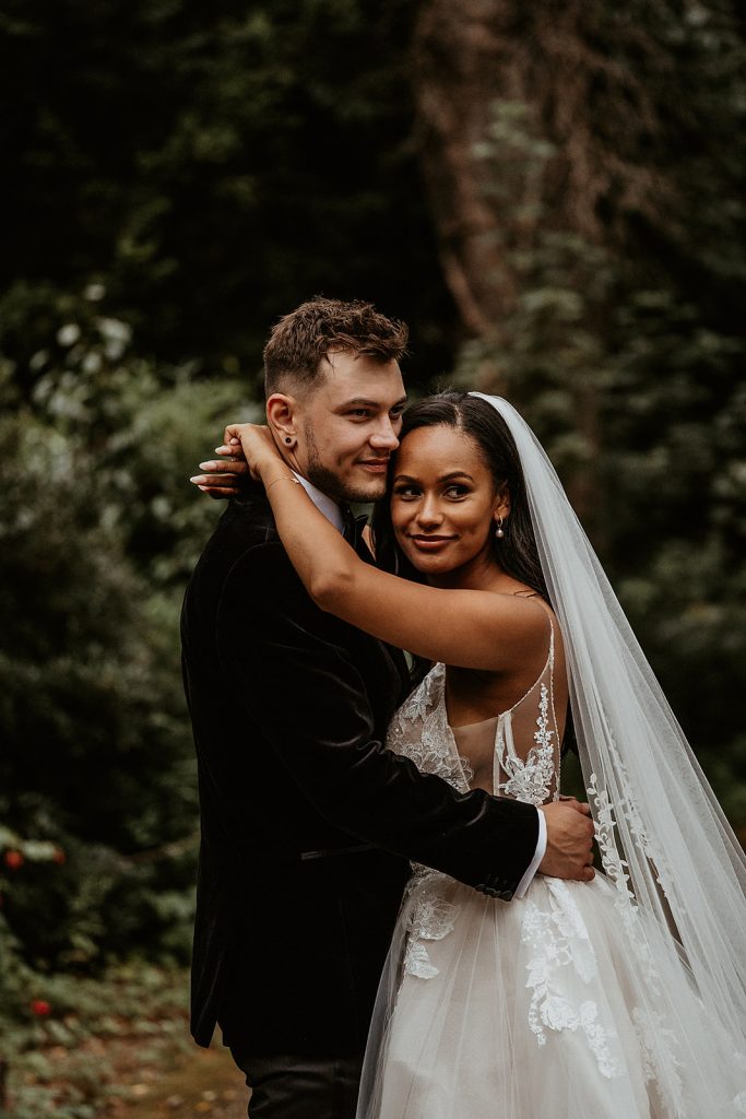 A newly wed bride and groom hold each other on their wedding day