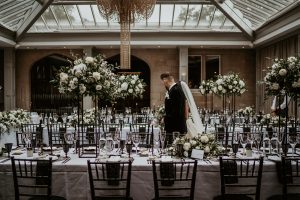 Newly wed couple take a look at their wedding vision become a reality as they see their wedding room fully dressed for the first time