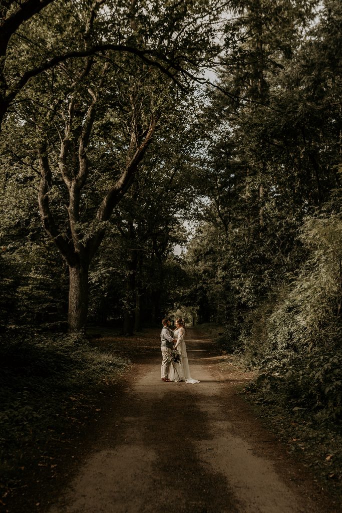 Newlyweds Aimee + Rob enjoy some alone time in the enchanted forest wedding setting