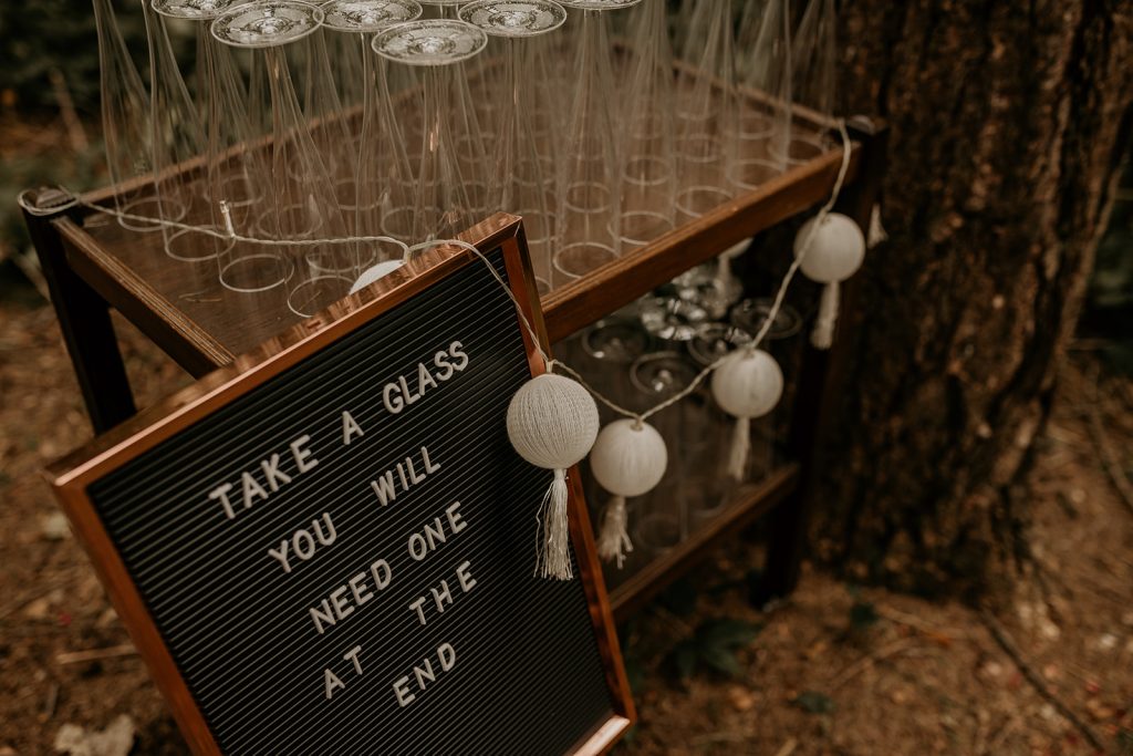 Pin board signage for modern boho woodland wedding ceremony