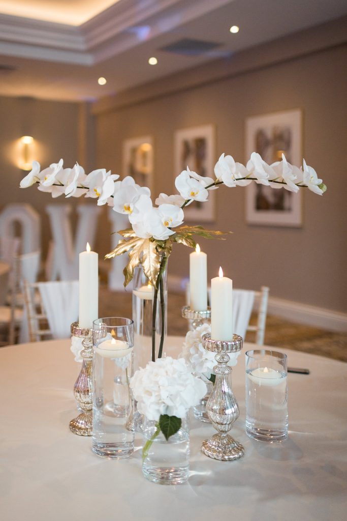 Dusk wedding reception shoot featuring all white styling and couture gowns