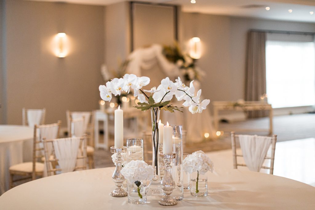 Dusk wedding reception shoot featuring all white styling and couture gowns