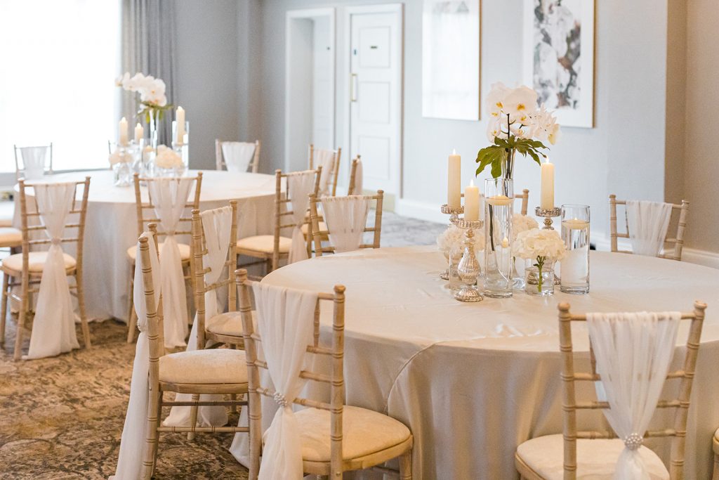 Dusk wedding reception shoot featuring all white styling and couture gowns