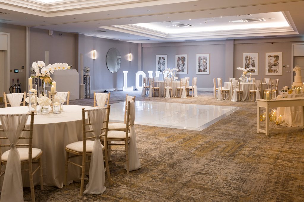 Dusk wedding reception shoot featuring all white styling and couture gowns