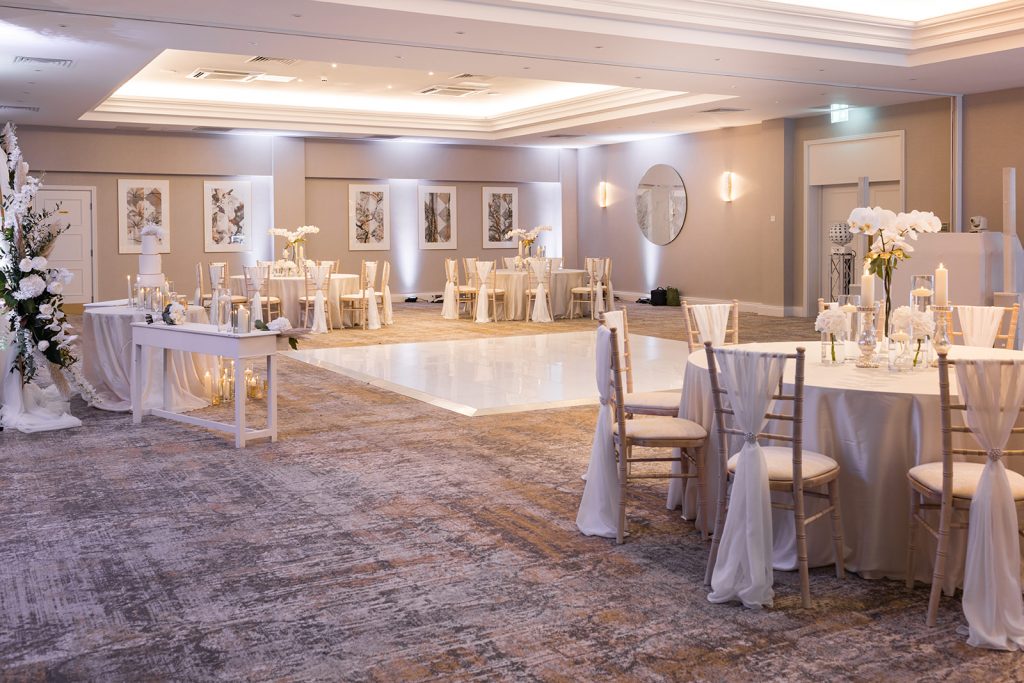 All white evening reception styling for luxurious wedding