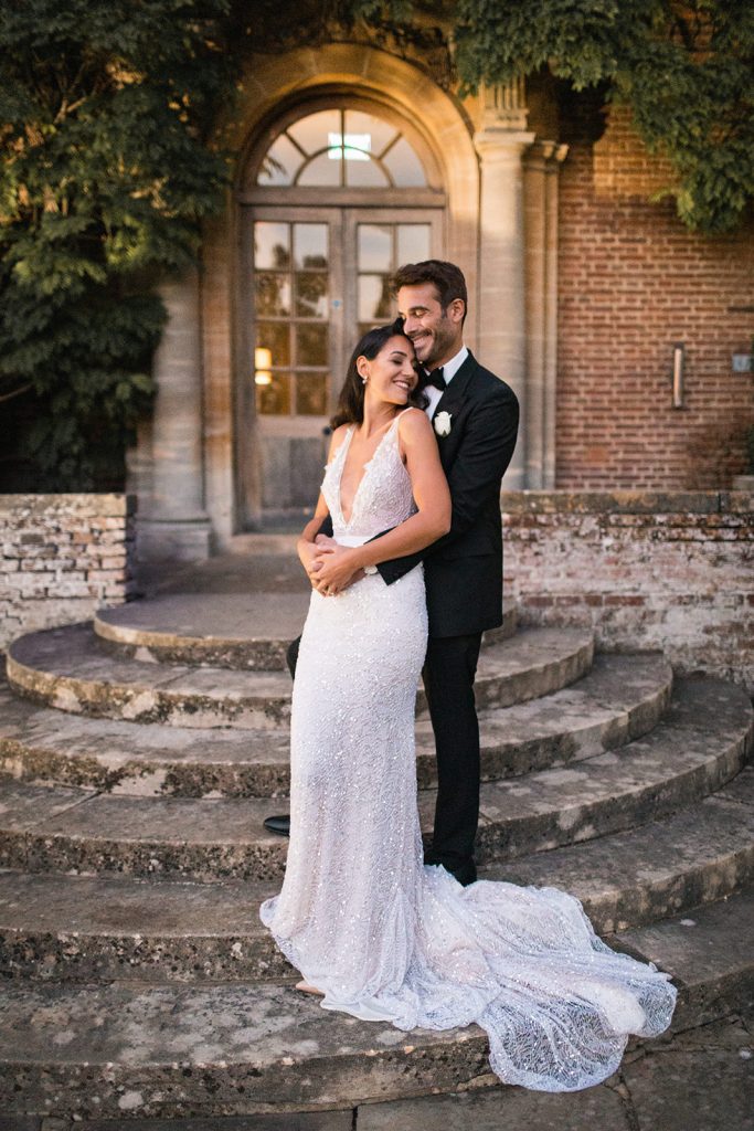 Dusk wedding reception shoot featuring all white styling and couture gowns
