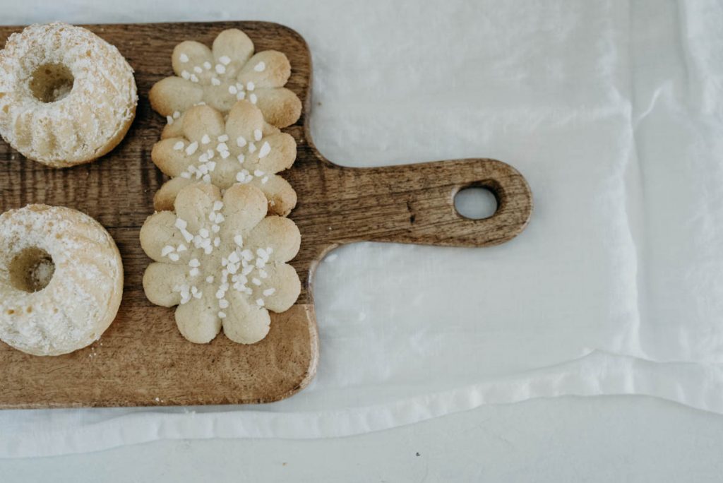 Danish biscuits displayed on a wooden board for minimalist neutral coloured wedding