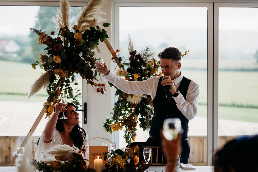 Speech time for Autumn boho wedding couple