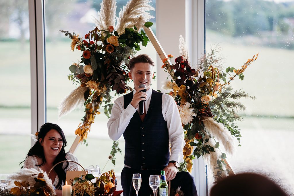 Speech time for Autumn boho wedding couple