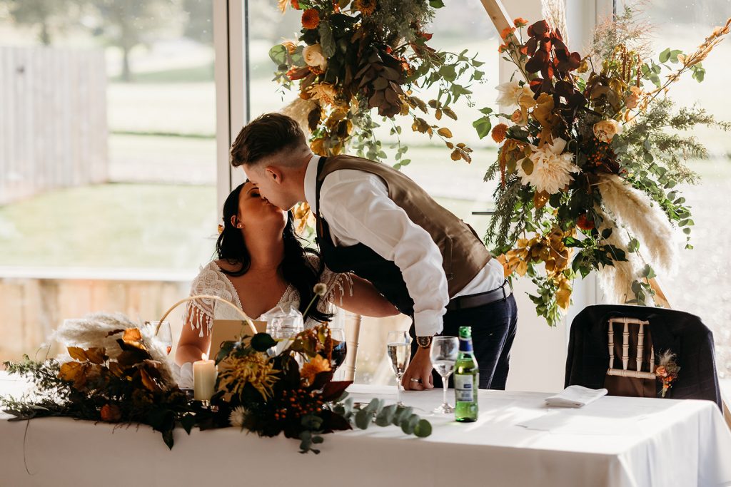 Speech time for Autumn boho wedding couple