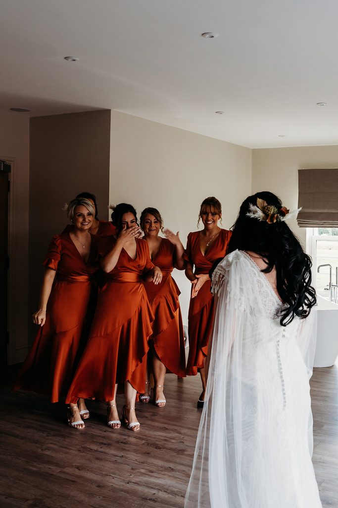Bridesmaids first look at bride Kiana's wedding dress on the wedding morning