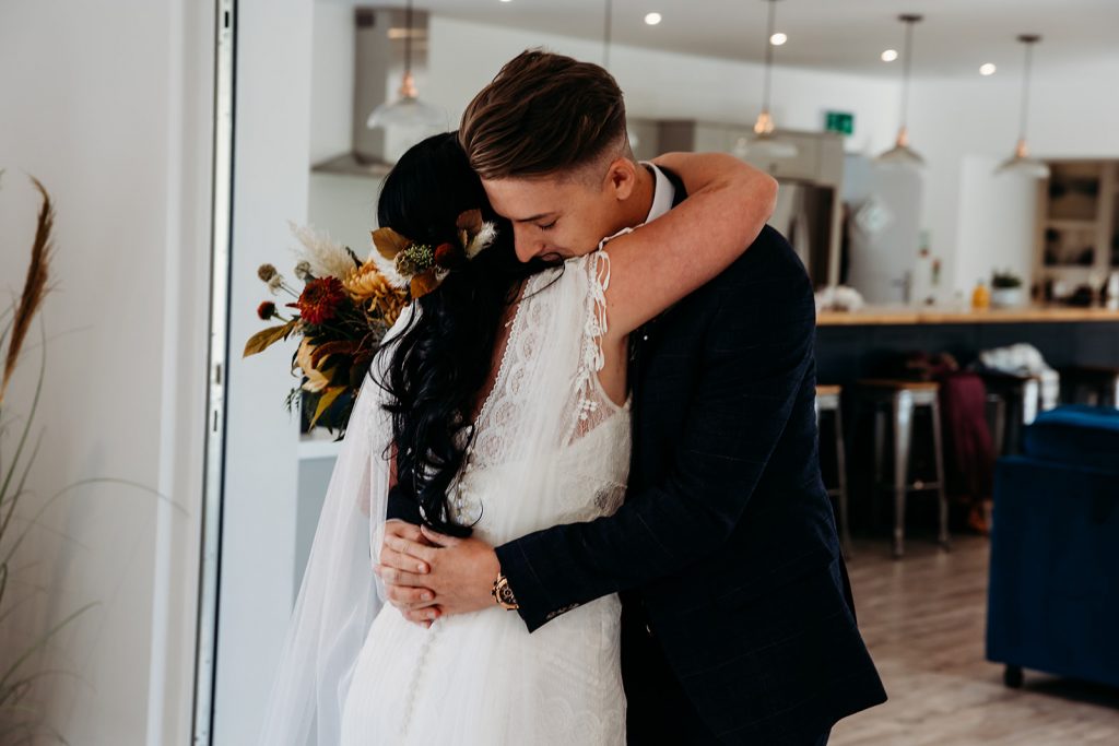 An emotional 'First Look' for bride and groom before their wedding ceremony