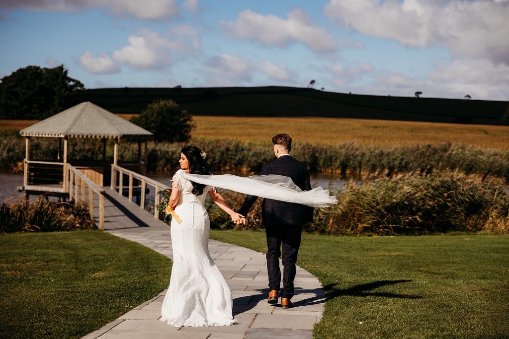 Bride and Groom head to the lakes at their Somerset wedding venue for some portrait shots to be taken