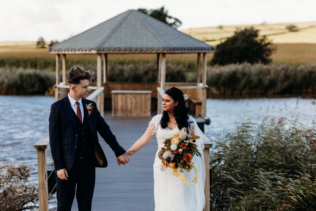 Newlyweds enjoying some quiet couple time in the grounds at Quantock Lakes